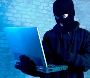 Bad guy stealing info from laptop