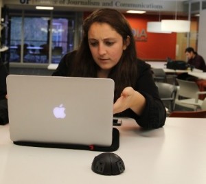 Student looking stressed with her laptop