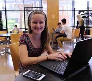 Student working on laptop in Library West
