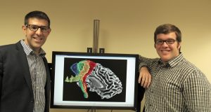 Photo: Stephen Coombes and Derek Archer with image of corticospinal tract, produced on HiPerGator
