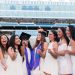 PHOTO: Group of female students celebrating graduation at Florida Field.