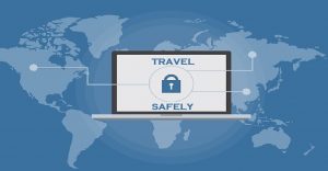 GRAPHIC: World map with a laptop that says "TRAVEL SAFELY"