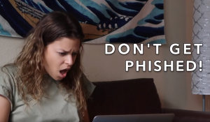 PHOTO: Student looking at laptop with text "Don't get phished!"