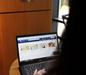 PHOTO: Staff member using LinkedIn Learning while in Library West