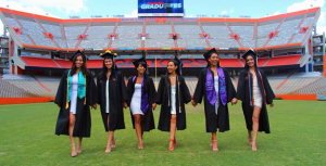 PHOTO: Female graduates posing on Florida Field in The Swamp