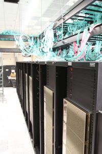 PHOTO: Wiring from ceiling connecting to NVIDIA machines, UF Data Center