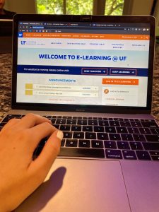 PHOTO: Welcome to E-Learning @ UF homepage open on laptop