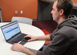 PHOTO: Male student on the UF Grammarly discounted software page. University of Florida.