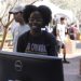 PHOTO: Female student learning at the AI in education table, during the 2023 Tech Fair. University of Florida.