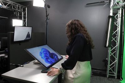 PHOTO: Staff member in UF Information Technology (UFIT) video production studio, using Surface Pro equipment. University of Florida.